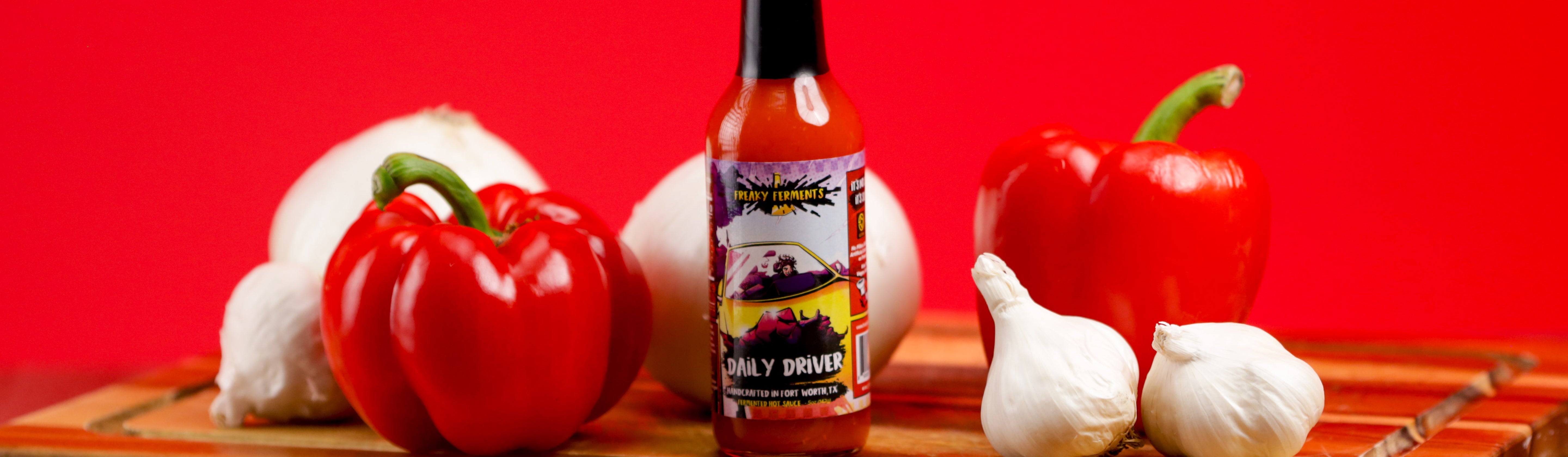 photo of a bottle of Daily Driver in front of ingredients